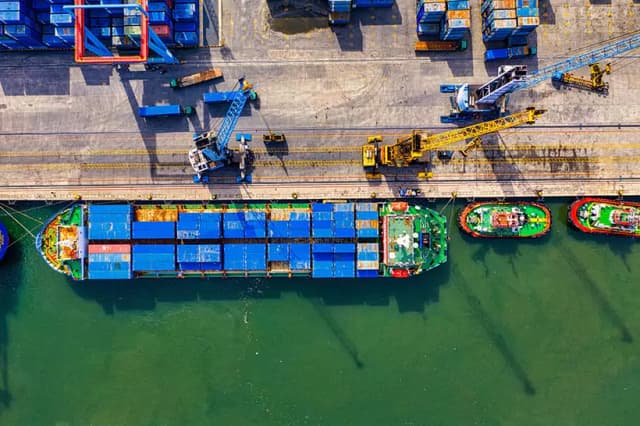 a container ship loading at port